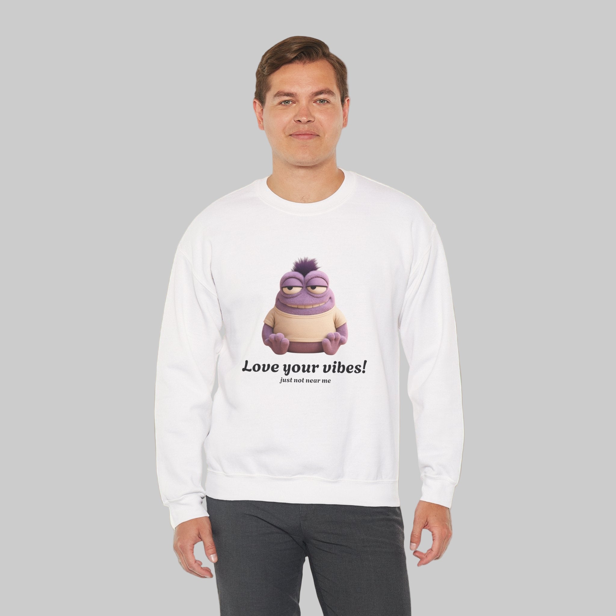 Person wearing a white sweatshirt with a cartoon character and text on a white background